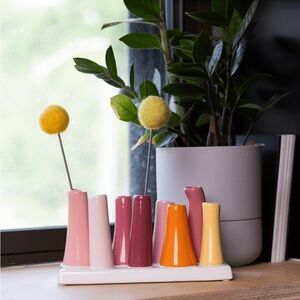 Chive Pooley ceramic bud vase featuring eight colorful tubes